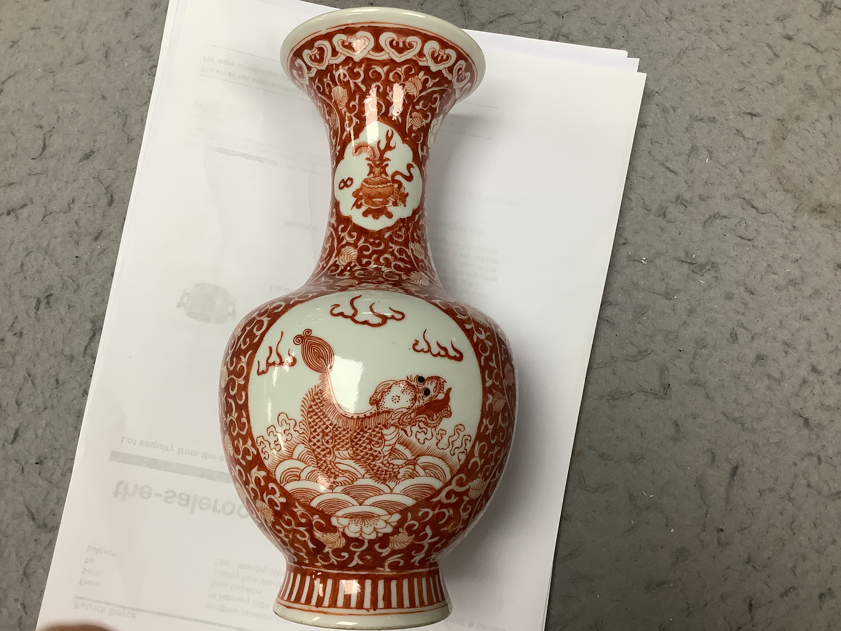 A Chinese iron red enamelled 'mythical beast' vase, early 20th century, 21cm high